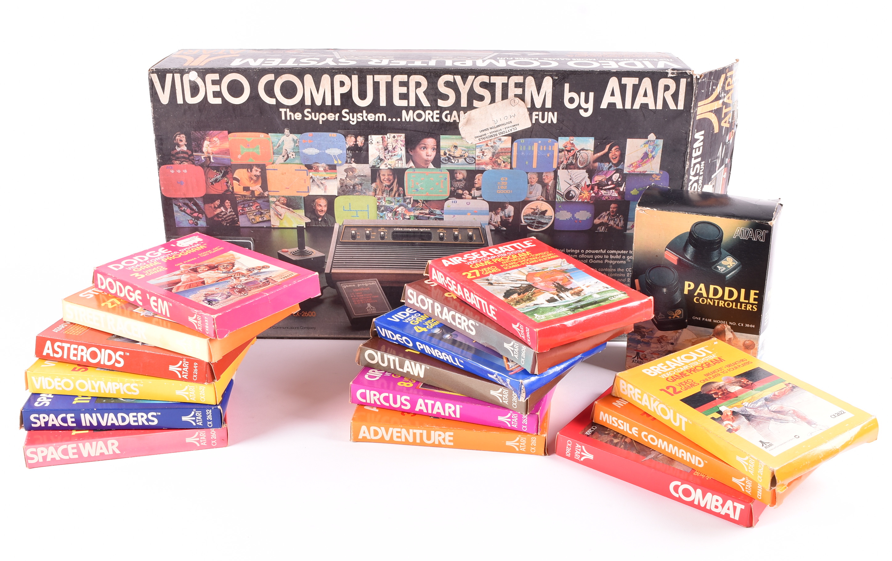 An early Atari 2600 'VCS' Video Computer System, with games and accessories - £165